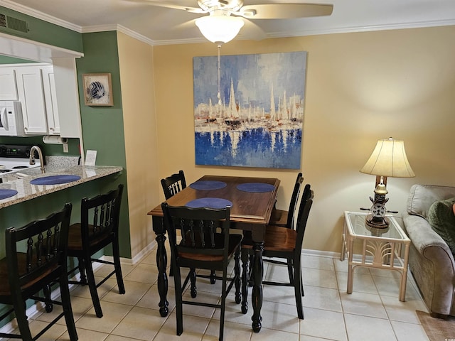 207 N 3rd Ave N Unit 247, North Myrtle Beach, SC 29582 - dining area with ceiling fan, ornamental molding, light tile patterned floors, and baseboards