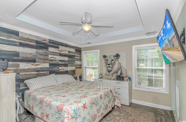 3827 El Duce Pl, Myrtle Beach, SC 29588 - bedroom with a tray ceiling, multiple windows, baseboards, ornamental molding, and a ceiling fan