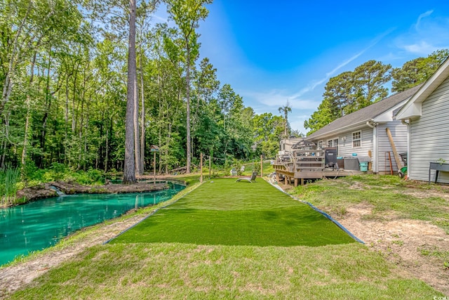 3827 El Duce Pl, Myrtle Beach, SC 29588 - view of green lawn featuring a deck