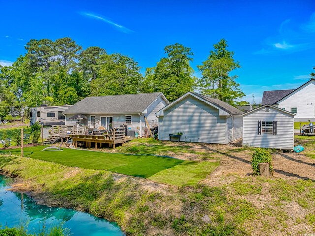 3827 El Duce Pl, Myrtle Beach, SC 29588 - back of house featuring a wooden deck and a lawn
