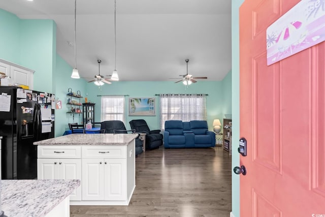 4338 Grande Harbour Blvd, Little River, SC 29566 - kitchen featuring black fridge, a ceiling fan, light wood finished floors, and high vaulted ceiling