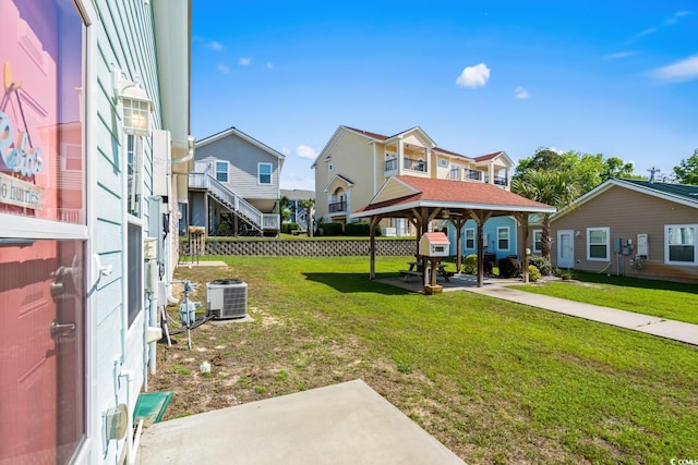 4338 Grande Harbour Blvd, Little River, SC 29566 - view of green lawn featuring central AC unit, a residential view, and a gazebo