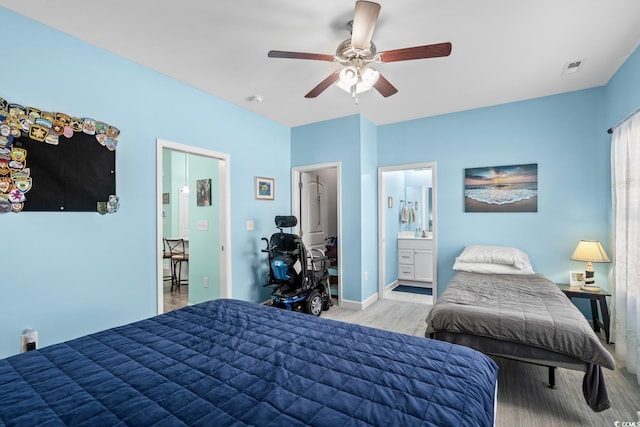 4338 Grande Harbour Blvd, Little River, SC 29566 - bedroom with light wood-type flooring, a ceiling fan, ensuite bath, and baseboards