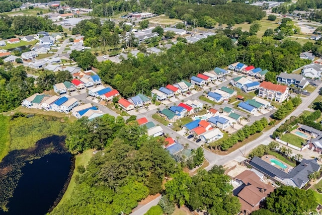 4338 Grande Harbour Blvd, Little River, SC 29566 - view of property location featuring a nearby body of water, nearby suburban area, and a tree filled landscape
