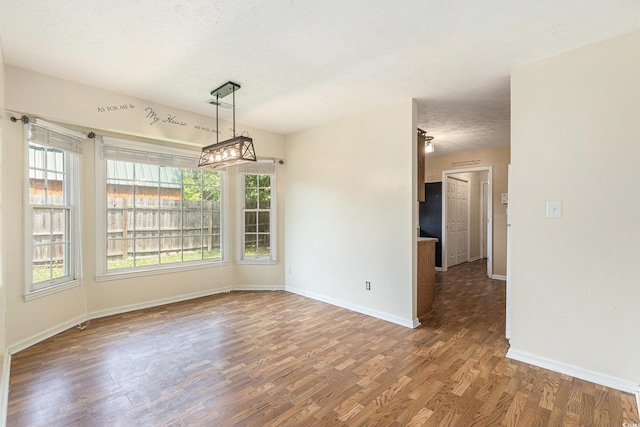 3429 Mishoe St, Loris, SC 29569 - unfurnished room with wood finished floors and a textured ceiling