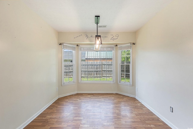 3429 Mishoe St, Loris, SC 29569 - unfurnished dining area featuring wood finished floors and baseboards