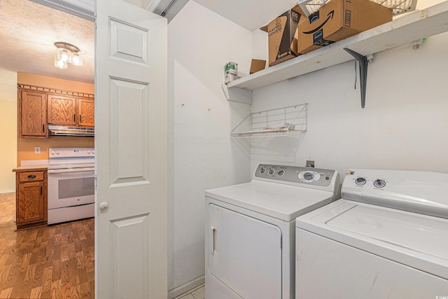 3429 Mishoe St, Loris, SC 29569 - laundry area with separate washer and dryer and wood finished floors