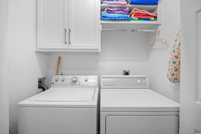 laundry room featuring cabinet space and washer and dryer
