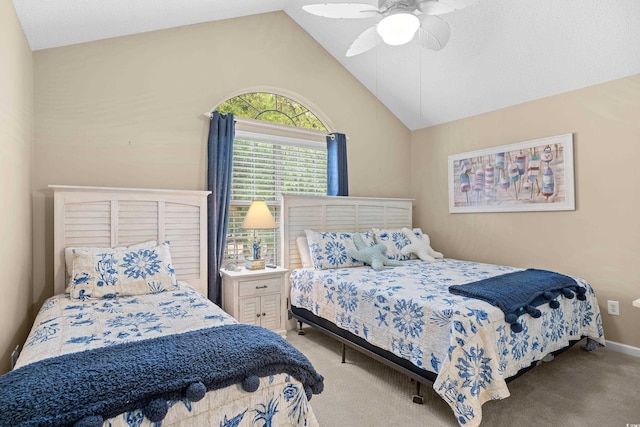 carpeted bedroom featuring lofted ceiling, ceiling fan, and baseboards