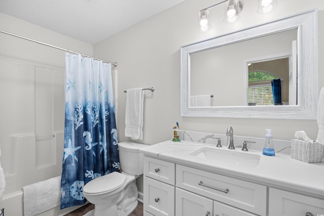 full bathroom featuring toilet, vanity, wood finished floors, a textured ceiling, and shower / tub combo