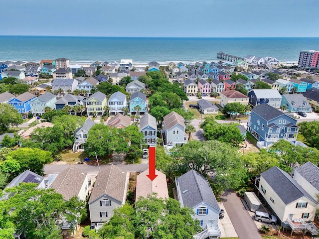 aerial view of residential area featuring a large body of water