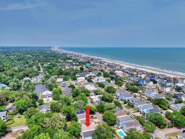 aerial view of residential area with waterfront with a beach