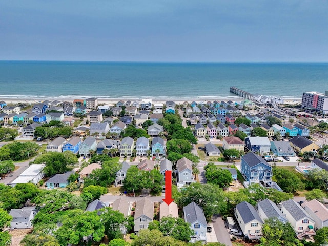 aerial perspective of suburban area featuring a large body of water