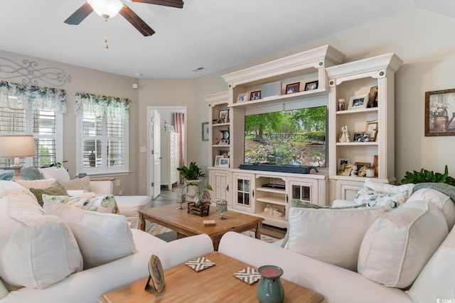 living area with ceiling fan
