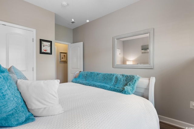 bedroom featuring baseboards
