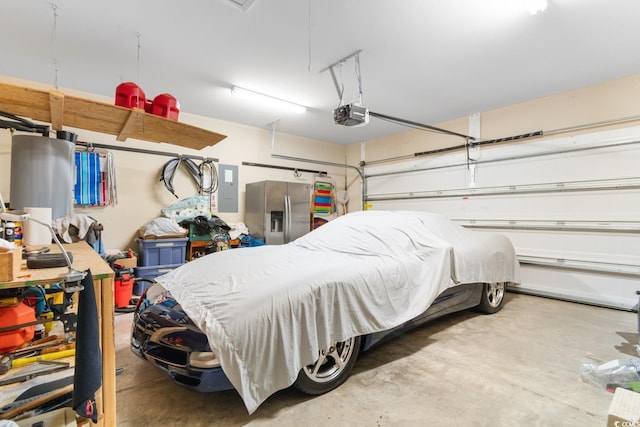 garage with stainless steel fridge, electric panel, and a garage door opener