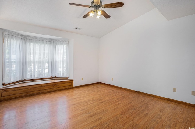 4311 Bradford Cir, Myrtle Beach, SC 29588 - spare room with light wood-style floors, vaulted ceiling, baseboards, and ceiling fan