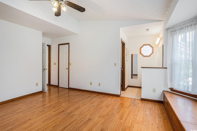4311 Bradford Cir, Myrtle Beach, SC 29588 - spare room with light wood finished floors, ceiling fan, healthy amount of natural light, lofted ceiling, and baseboards