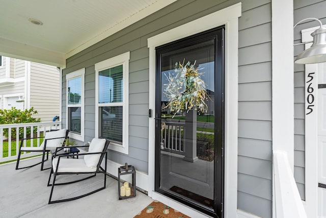 doorway to property featuring a porch
