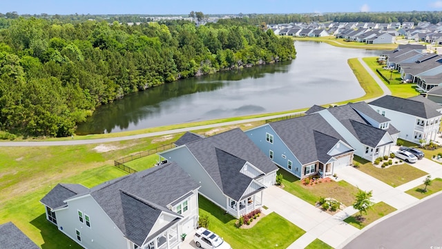 aerial perspective of suburban area with a large body of water