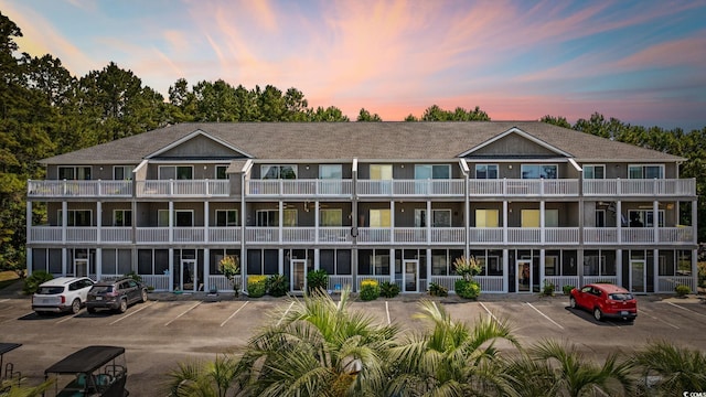 4506 W Harbor Ct Unit U-15, Little River, SC 29566 - view of building exterior with uncovered parking