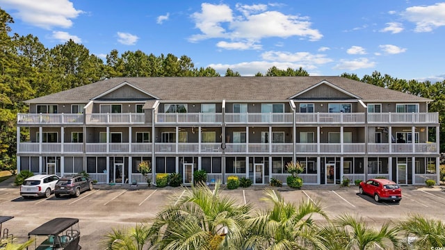 4506 W Harbor Ct Unit U-15, Little River, SC 29566 - rear view of house with uncovered parking