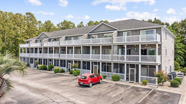 4506 W Harbor Ct Unit U-15, Little River, SC 29566 - view of building exterior with uncovered parking