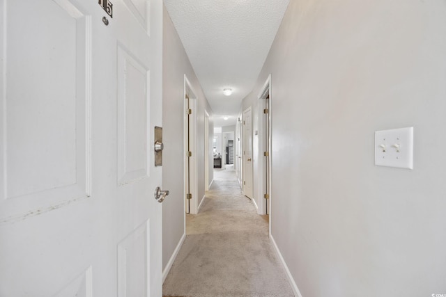4506 W Harbor Ct Unit U-15, Little River, SC 29566 - hall featuring light colored carpet and a textured ceiling