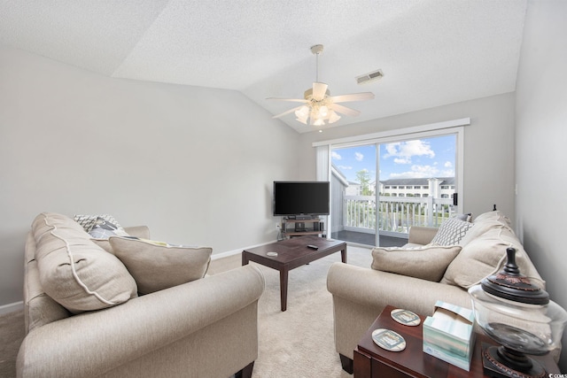 4506 W Harbor Ct Unit U-15, Little River, SC 29566 - living room with light carpet, ceiling fan, vaulted ceiling, and a textured ceiling