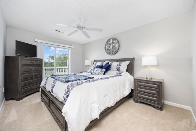 4506 W Harbor Ct Unit U-15, Little River, SC 29566 - bedroom with light carpet, access to exterior, and a ceiling fan