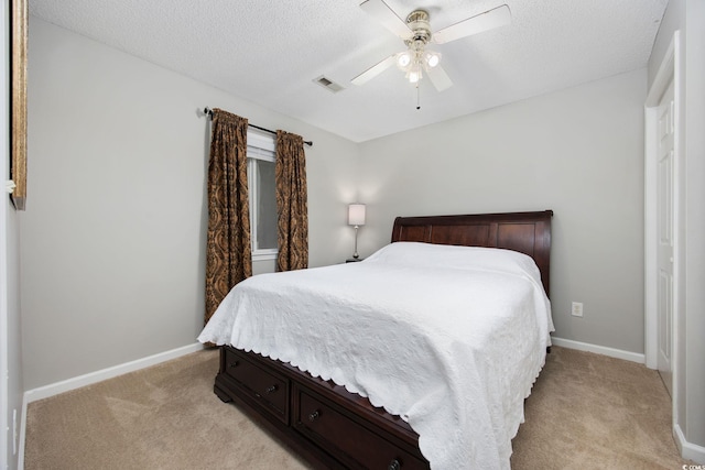 4506 W Harbor Ct Unit U-15, Little River, SC 29566 - bedroom with light colored carpet, a textured ceiling, and ceiling fan