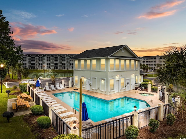 4506 W Harbor Ct Unit U-15, Little River, SC 29566 - pool at dusk with a community hot tub, a community pool, a patio, and grilling area