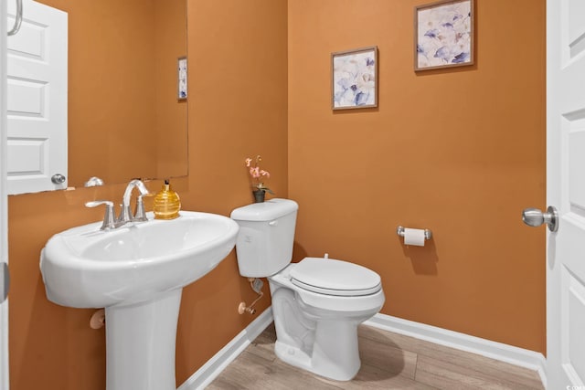 3021 Sistine St, Myrtle Beach, SC 29579 - bathroom featuring wood finished floors, baseboards, toilet, and a sink