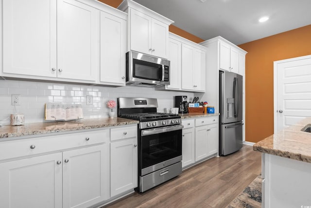 3021 Sistine St, Myrtle Beach, SC 29579 - kitchen featuring stainless steel appliances, white cabinetry, backsplash, and wood finished floors