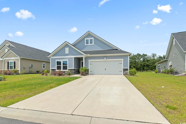 3021 Sistine St, Myrtle Beach, SC 29579 - craftsman-style house with stone siding, board and batten siding, a front yard, and concrete driveway