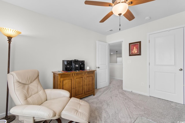 818 Mourning Dove Dr, Myrtle Beach, SC 29577 - living area with light colored carpet, baseboards, and ceiling fan