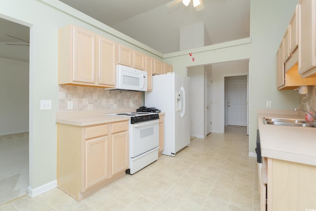 1044 Vestry Dr, Murrells Inlet, SC 29576 - kitchen with white appliances, a sink, decorative backsplash, light countertops, and ceiling fan