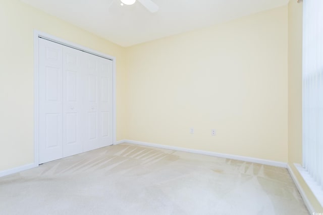 1044 Vestry Dr, Murrells Inlet, SC 29576 - unfurnished bedroom featuring light carpet, baseboards, a closet, and a ceiling fan