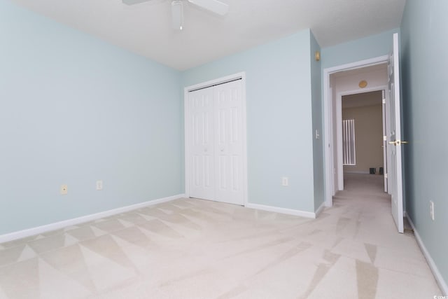 1044 Vestry Dr, Murrells Inlet, SC 29576 - unfurnished bedroom with light carpet, a closet, baseboards, and a ceiling fan