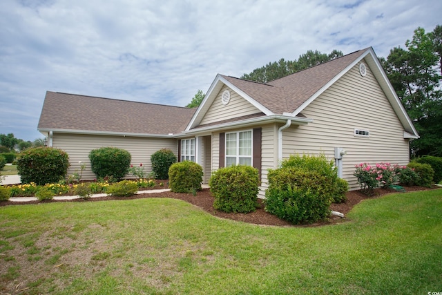 1044 Vestry Dr, Murrells Inlet, SC 29576 - view of property exterior featuring a shingled roof and a yard