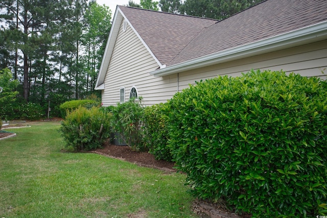 1044 Vestry Dr, Murrells Inlet, SC 29576 - view of property exterior featuring a shingled roof and a lawn