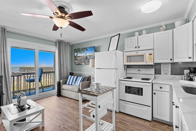6000 N Ocean Blvd Unit 119, North Myrtle Beach, SC 29582 - kitchen with white appliances, ornamental molding, a ceiling fan, light wood-style floors, and a textured ceiling