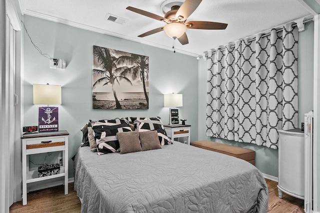 6000 N Ocean Blvd Unit 119, North Myrtle Beach, SC 29582 - bedroom with ornamental molding, wood finished floors, a ceiling fan, and baseboards