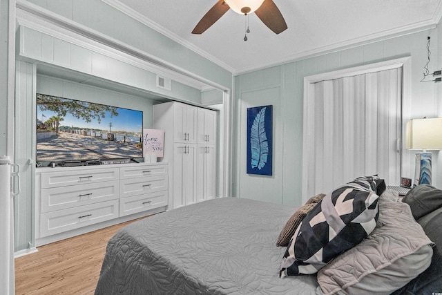 6000 N Ocean Blvd Unit 119, North Myrtle Beach, SC 29582 - bedroom with ornamental molding, light wood-style flooring, and ceiling fan