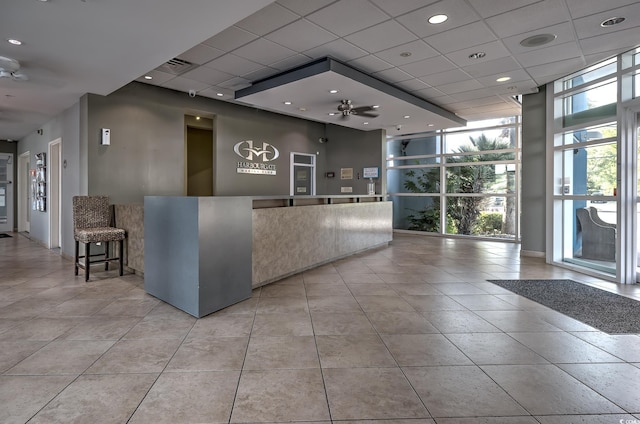 2100 Sea Mountain Hwy Unit 202, North Myrtle Beach, SC 29582 - welcome area featuring a wall of windows, a drop ceiling, and a ceiling fan