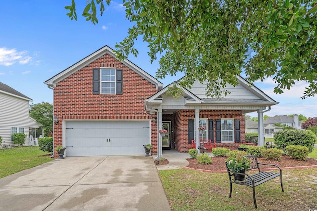 traditional-style house with concrete driveway, brick siding, a garage, and a front yard