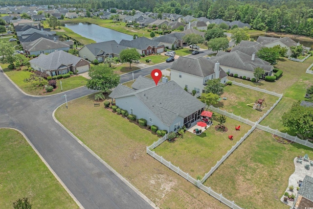 aerial perspective of suburban area with a large body of water