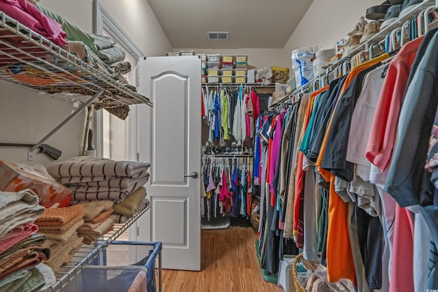 spacious closet with wood finished floors