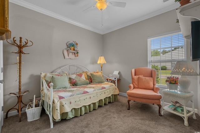 carpeted bedroom with ornamental molding, ceiling fan, and baseboards