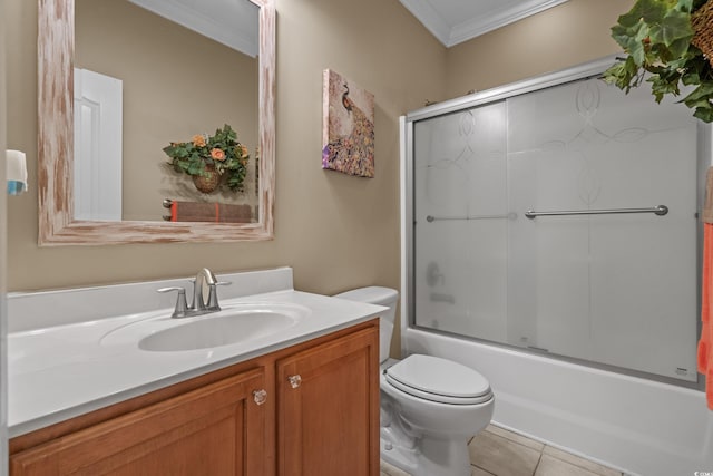 full bathroom featuring ornamental molding, toilet, vanity, combined bath / shower with glass door, and tile patterned floors